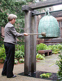 Shirley Tilghman ringing garden bell