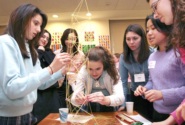 high school students build a tower from spagetti and gumdrops