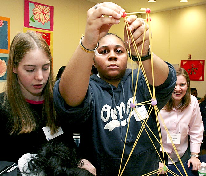 high school student building a tower from spagetti and gumdrops