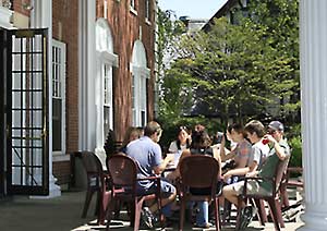 Students dine on the patio at Colonial Club