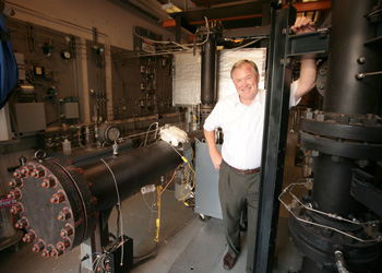 photograph of Fred Dryer with variable-pressure flow reactor