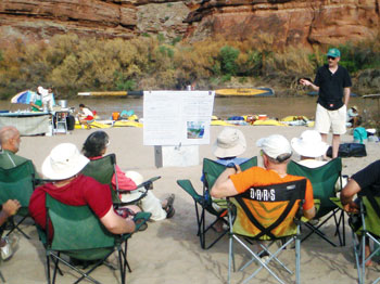 Professor Eric Wood (standing) holding “class” at the group’s camp site